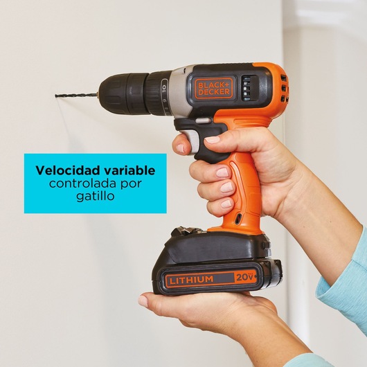 BLACKDECKER BCKSB29C02 cordless drill with orange and black design, 20V lithium battery, shown drilling into wall.