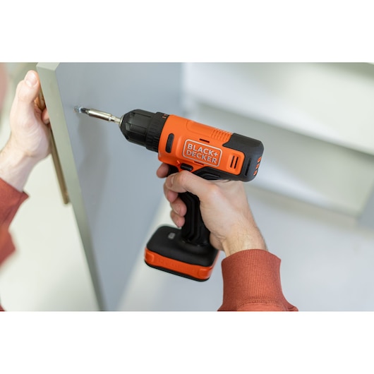 BLACK+DECKER screwdriver application with hand/person included