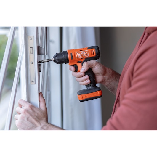 BLACK+DECKER screwdriver application with hand/person included